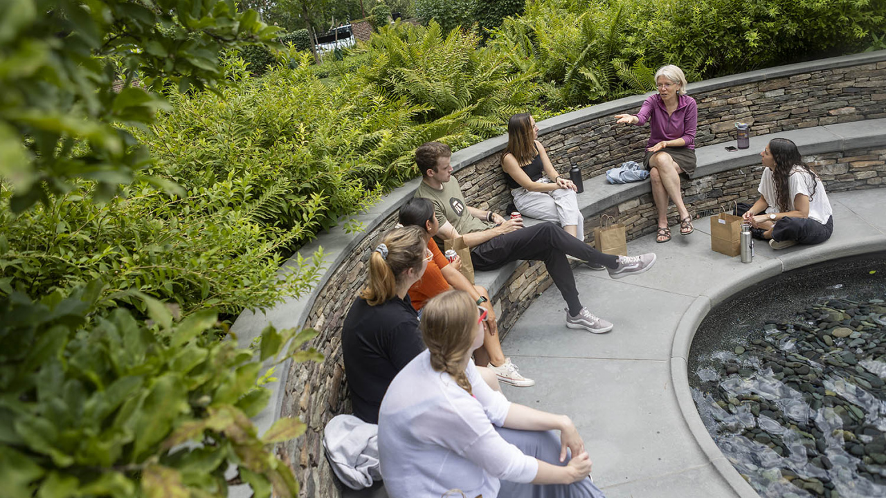 HGSE professor teaching a class in the sunken garden