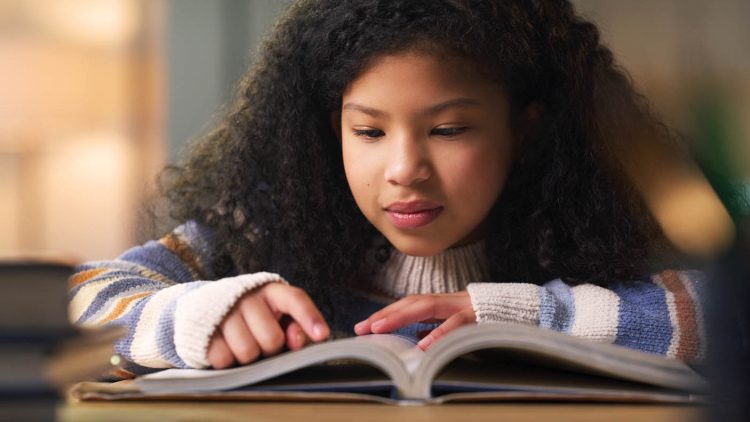 Young girl reading a book